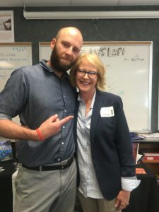 A picture with Garrett Jacobson and Jodi Burnett in Jacobson's classroom.